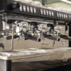 Close-up of the La Cimbali M26 TE RE steam wand, pressure gauge, and Istituto Espresso Italiano certification